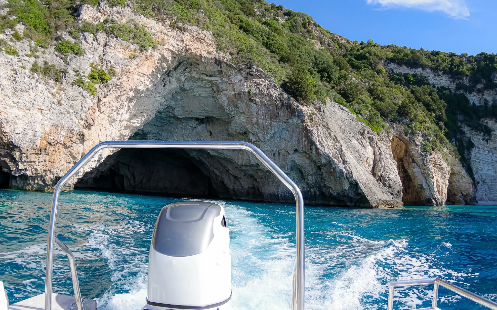 Speed boat leaving Blue Caves Paxos